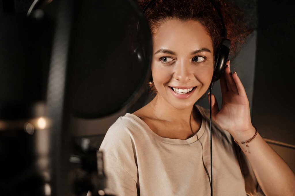 beautiful-singer-listening-sound-in-headphones-wor-2022-02-02-03-57-34-utc.jpg