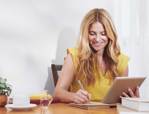 smiling-businesswoman-writing-in-planner-2021-08-26-19-52-29-utc.jpg